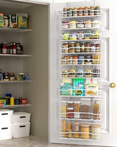 the pantry door is open to reveal an assortment of food items and containers on shelves