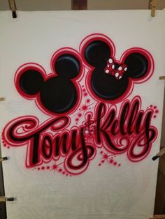 mickey mouse and minnie mouse with the word tony kly painted on it