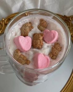 heart shaped cookies and milk in a glass bowl