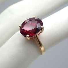 Vintage 14k (.585) yellow gold ring with an oval cut Almandine (deep color) Garnet centerpiece. This elegant ring is a size 6 1/2, it is 11.5 mm wide, weighing 2.8 grams. EA4842 Gold Oval Ruby Ring For Formal Occasions, Gold Oval Birthstone Ring For Formal Occasions, Oval Ruby Ring In 14k Gold, Formal Oval 14k Gold Birthstone Ring, 14k Gold Oval Birthstone Ring For Formal Occasions, Formal Oval Yellow Gold Birthstone Ring, Formal 14k Gold Oval Birthstone Ring, Formal Oval Birthstone Ring Stamped 14k, Garnet Gem