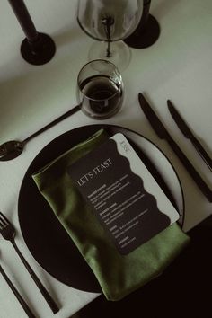 the table is set with black and white place settings