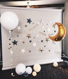 there are balloons and stars on the wall