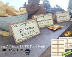 some food items are sitting on a table with labels and tags around them that read pot - ta - ta - tots