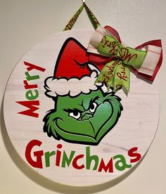 a merry grinmas sign hanging on the wall