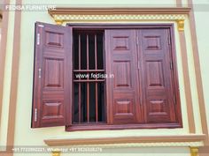 an open window with wooden shutters on the outside