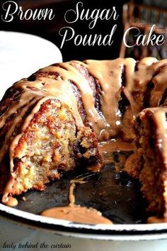 a bundt cake covered in icing and drizzled with caramel