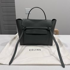 Celine Mini Belt Bag In Gray. Worn A Couple Of Times, In Perfect Condition. 11 X 9 X 6 In (27 X 23 X 16 Cm) Calfskin Suede Calfskin Lining Gold Finishing Shoulder And Hand Carry Flap Closure With Hidden Metallic Piece And Zipped Closure Under The Flap Inner Double Flat Pocket Outer Zipped Pocket On The Back Removable Leather Strap With 14 In (36 Cm) Drop Handle With 4 In (9 Cm) Drop Protective Studs On The Base Celine Mini Belt Bag, Mini Belt Bag, Celine Bags, Belt Bag, X 23, Calf Skin, Leather Straps, Bag Lady, Grey