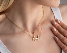 "This gold layered necklace (Name Necklace with Birthstone, Personalized Name Necklace, 2 Layered Necklace) would make the perfect personalised gift for a birthday, Christmas, mother, bridesmaid, bride, grandma, teenage girl, daughter or a new mom. Also this gold layered necklace will be a great baby shower, anniversary, bridal shower, valentines day, graduation, engagement gift.  Our dainty name jewellery has been produced with high quality 925k solid silver. With choice of beautiful custom fonts you can make your unique necklace. You can also make an Arabic name jewellery as well. This trendy gold layered name necklace with a birthstone are available in silver gold and rose gold.   FEATURES: * custom font choices * upper or lower case * custom birthstone crystals * available in 14K rose Birthstone Crystals, Arabic Necklace, Gold Layered Necklace, Sideways Initial Necklace, Double Layer Necklace, Necklace Name, Layered Necklace Set, Layered Chains, Lower Case