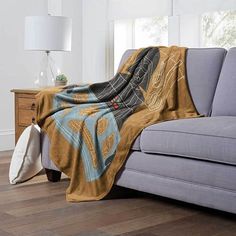 a couch with a blanket on top of it