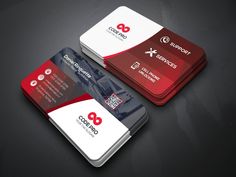 two red and white business cards on a black surface, with the company's logo