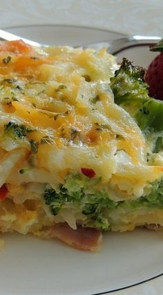 broccoli and cheese casserole on a white plate