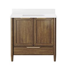 a bathroom vanity with a white counter top and wooden cabinet doors on one side, and two drawers on the other