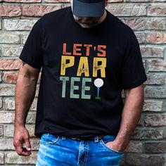 a man wearing a t - shirt that says let's par teef