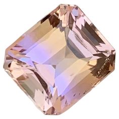 a pink diamond on a white background