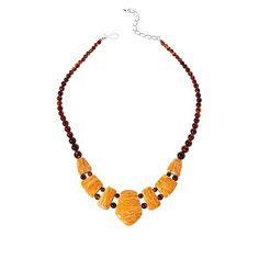 Jay King Brown Amber and Orange Spiny Oyster Shell Reversible Necklace You get two, fashionable looks in one with this unique, handcrafted brown amber and orange spiny oyster shell reversible necklace. Wear it as a solid amber piece or simply flip it over to add the fun, color contrast of orange spiny oyster shell.       Necklace approx. 18-1/4"L x 5/16"W with 2-3/4" extender     Center drop approx. 1-1/2"L x 1-1/8"W     Stamped .925      Hook closure     Brown amber necklace has drape with seve Handmade Baltic Amber Necklace In Brown, Orange Baltic Amber Pendant Necklace, Orange Baltic Amber Pendant Jewelry, Handmade Brown Baltic Amber Necklace, Brown Baltic Amber Round Jewelry, Brown Baltic Amber Jewelry, Round Brown Baltic Amber Jewelry, Artisan Orange Gemstone Necklace, Handmade Baltic Amber Orange Jewelry