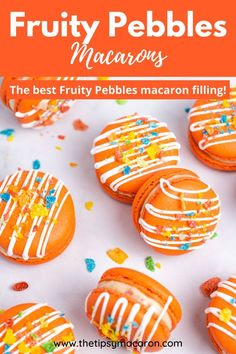 orange iced cookies with white frosting and sprinkles on top, surrounded by confetti