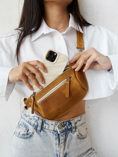 This leather hip bag is perfect for traveling or just to carry in your everyday bag. The personalized fanny pack will help you to keep all necessary staff like phone, wallet, cards, face mask in one place during the day. You can wear it as a belt bag or like a fanny pack or crossbody bag - it's up to your mood :) Great idea for birthday gift or Mother's day gift ! Bag can be personalized monogram. The Funny backpack is made from one piece quality Crazy Horse. When you hold it in your hands, you Bum Bag Outfit, Trendy Belts, Leather Hip Bag, Leather Waist Bag, Minimalist Bag, Spring Accessories, Leather Fanny Pack, Leather Belt Bag, Crossbody Bag Women