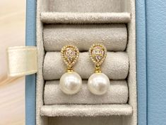 >> These elegant water drop earrings are made out of copper, 18k gold plated with 100% freshwater pearls and AAA high quality zirconia diamonds with micro-inset technology >> Pearls size: 10mm >> Height/drop of earrings size (including the pearl): 0.75in >> Width of earrings: 0.4in >> All pearls are natural, each pearl is unique, beautiful and has its own characteristic, some pearls have inclusions or natural cracks, therefore, there may be slight difference in appearance from earring to earring Diamond White Pearl Bridal Earrings As Gift, Diamond White Pearl Bridal Earrings, Bridal Pearl Drop Earrings With Cubic Zirconia As Gift, Diamond White Pearl Bridal Earrings For Gift, Exquisite Pearl Drop Bridal Earrings Gift, Luxury Pear-shaped Teardrop Earrings For Wedding, Pearl White Cubic Zirconia Bridal Earrings For Gift, Luxury Cubic Zirconia Teardrop Earrings Gift, Diamond White Pear Shaped Bridal Earrings