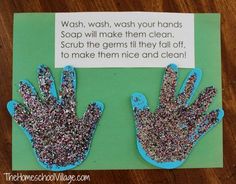 two handprints made to look like gloves on a green paper with words describing wash, wash your hands soap will make them clean