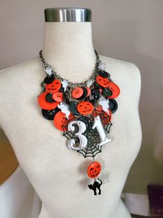 "Halloween Statement Necklace - One of a Kind - Vintage Black & Orange Buttons, Skeleton Keys, Ghost, Cat and Pumpkins, Spider Webs and Vintage Silver Metal \"31\" numbers - Only from Key of A Upcycled Jewelry~ This statement piece will be the envy of all your spooky friends this Halloween!  If you are not partaking in any costume parties, but you are going on a night out where you will be dressing up, why not accessorize your look with this one of a kind Halloween themed statement necklace!?  W Halloween Themed Black Necklace, Black Themed Necklace For Halloween, Themed Black Necklace For Halloween, Novelty Halloween Party Necklaces, Vintage House Numbers, Pumpkin Beads, Pumpkin Bead, Skeleton Keys, Halloween Necklace