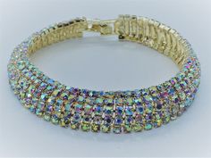 Handmade Ladies Aurora Borealis Crystal bracelet 7.5 inches in length.150 Aurora Borealis Austrian crystals. Free delivery. The shimmering glow from the Aurora Borealis crystals against the 18k Gold Plating. Designed in our studio here in Staffordshire, England. Completely flexible, fluid movement, perfect to wear with any outfit. A quite stunning look. Perhaps a gift for someone special, every piece of our jewellery comes gift wrapped. Shipped FREE! Elegant Iridescent Crystal Bracelet For Party, Iridescent Bracelet For Party, Fluid Movement, The Aurora Borealis, Set Bracelet, Staffordshire England, Aurora Borealis Crystal, The Aurora, Crystal Set