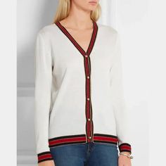 The Knit Of This Cardigan From Gucci Is Spun From A Soft Ivory Wool; And Is Adorned With Red, Midnight-Blue, And Gold Ribbed Web Stripes On The Edges. It Features Long Sleeves, A V-Shaped Neckline, And Fastens With Lustrous Swarovski Pearl Buttons For A Vintage Feel. Condition: Great; Moderate Marking. Comes With Box. Size: S Approximate Measurements: Shoulder: 14.75" (37.5 Cm) Chest: 17.5" (44.5 Cm) Length From Back: 24.5" (62 Cm) Sleeve Length: 23.5" (60 Cm) Composition: Fabric: 100% Wool. Trimming: 72% Wool, 20% Rayon, 8% Metallised Fiber. Trimming 1: 85% Wool, 10% Viscose, 5% Metallised Fiber. Gucci Luxury V-neck Cardigan, Luxury Gucci V-neck Cardigan, Classic Gucci V-neck Cardigan, Gucci Designer V-neck Cardigan, Designer Gucci V-neck Sweater, Fitted Designer Gucci Sweater, Designer Fitted Gucci Sweater, Fitted Luxury White Cardigan, Luxury Fitted White Cardigan