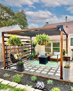 an outdoor patio with plants and furniture