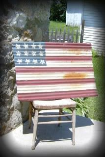 an old wooden chair with the american flag painted on it