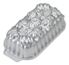 a metal cake pan with flowers on it