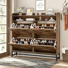 a wooden shoe rack filled with lots of shoes