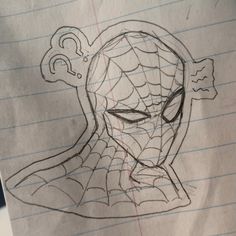 a drawing of a spider - man's face on lined paper