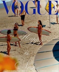 people walking on the beach with surfboards in their hands and one woman holding a surfboard