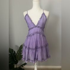 Perfect Condition - Nwt Adjustable Straps Super Flattering And Perfect Sundress! Purple V-neck Sundress For Spring, Purple V-neck Spring Sundress, Purple Cotton Mini Dress For Vacation, Lavender Sleeveless Sundress, Purple Sundress For Spring, Purple Spring Sundress, Lavender Sleeveless Mini Dress With Ruffles, Chic Purple Mini Sundress, Fitted Lavender Summer Dress