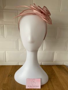 Add a touch of charm with this dusty pink sinamay floral fascinator. Featuring delicate floral details and adorned with pretty lurex threads, this elegant piece is perfect for any special occasion.  Ideal for weddings, races, and elegant events. Dimensions approx: 21cm by 14cm. Item Details: Color: Dusty Pink Material: Sinamay Embellishments: Floral details, lurex threads Dimensions: 21cm x 14cm Style: Floral fascinator Ideal for: Weddings, races, special occasions Attachment: Alice band Formal Pink Hair Accessories, Pink Hair Accessories For Spring Formal Events, Spring Tulle Fascinator, Elegant Tulle Mini Hats For Spring, Pink Formal Hair Accessories, Elegant Pink Hair Accessories For Formal Occasions, Elegant Pink Hair Accessories For Royal Ascot, Elegant Pink Fascinator For Events, Elegant Pink Fascinator For Event