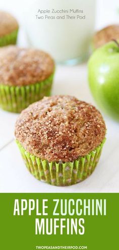 apple zucchini muffins on a table with apples and milk in the background