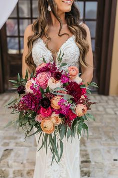 a woman in a wedding dress holding a bouquet