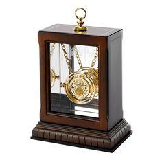 a wooden case with a clock inside of it