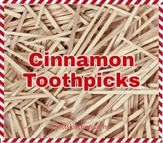 the words cinnamon toothpicks are in red and white striped paper on top of a pile