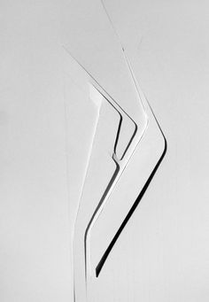 an abstract glass sculpture is shown in black and white, as well as the shape of a woman's body