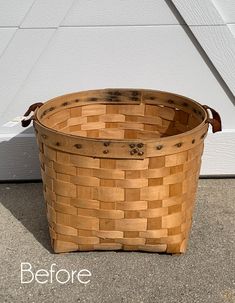 a wooden basket sitting in front of a white door