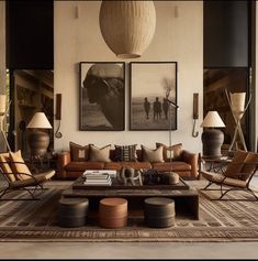 a living room filled with lots of furniture and pictures on the wall above it's coffee table