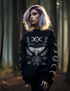 Wrap yourself in comfort and exude the power of nature with our irresistibly soft and warm Forest Witch sweatshirt. Designed for modern mystics and spiritual seekers, this sweater seamlessly blends esotericism with modern comfort. Made from 50% cotton and 50% polyester, it provides a cozy and breathable experience. Elevate your everyday style and connect with your natural magick through this unique addition to your wardrobe staples. Also makes the perfect gift for any witchy friend in your life. Professional Witch Work Outfits, Casual Witch Aesthetic, Witchy Astethic Outfits, Witchy Fashion Modern Witch, Witch Style Outfits, Plus Size Witchy Outfits, Witch Core Outfits, Witchy Sweater, Witch Aesthetic Fashion