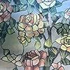 a painting of roses in a vase on a window sill with the reflection of them