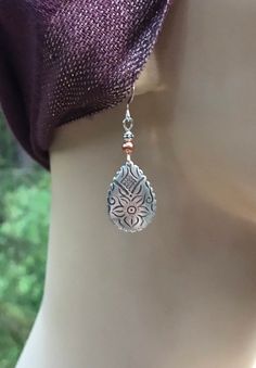 Etched silver and copper Boho teardrop earrings 🌸These beautiful earrings are VERY lightweight! The silver and copper are a great combination with floral etching on the silver pieces. These earrings are 1.5 inches  xlong and a half inch wide. Weight is 2.0 grams. French earwires are sterling silver.All my jewelry comes gift boxed with a custom Shelly Mariposa Design butterfly card ready for gift giving, whether it is a gift for you or someone special.Your satisfaction is very important to me. I Traditional Silver Drop Jewelry, Bohemian Silver Drop Jewelry, Handmade Teardrop Copper Earrings, Bohemian Silver Teardrop Earrings, Metal Dangle Jewelry With Etched Details, Silver Engraved Teardrop Earrings, Etched Metal Dangle Jewelry, Bohemian Silver Etched Earrings, Silver Etched Bohemian Earrings