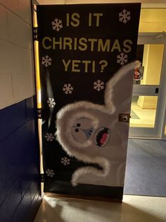 a door decorated to look like a christmas yeti? with snowflakes on it