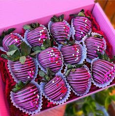 a pink box filled with chocolate covered strawberries