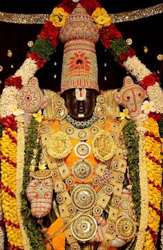 an elaborately decorated mannequin with flowers and decorations