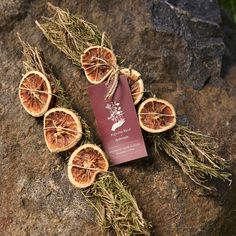 dried oranges on top of a rock next to a red packet with the label