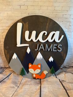 a wooden sign that says lucas james with a fox on it