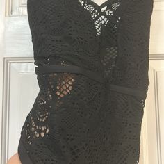 This Is An Amazing Black Sexy Swim Suit By Kenneth Cole’s Reaction Line. It Is A Very Pretty Lace Overlay Suit That Is Lined In All The Right Places And See Through Unlined Between Bust And On Waist Sides. The Straps In Back Are Criss Crossed And Adjustable. The Back Is A Scoop Back-Very Pretty. I Have L Or Xl. Size L Or Xl -Please Comment Bin= Swim Ziplock Nwt Black Underwire Bodysuit For Beachwear, Sleeveless Black Bodysuit With Lace Closure, Black Bodysuit With Built-in Bra For Club, Black Beachwear Bodysuit With Built-in Bra, One-piece Bodysuit With Built-in Bra For Night Out, Black One-piece Beachwear Intimate, Black Underwire Bodysuit With Lined Body, Fitted Hollow Out Bodysuit For Club, Black Party Bodysuit With Lace Closure